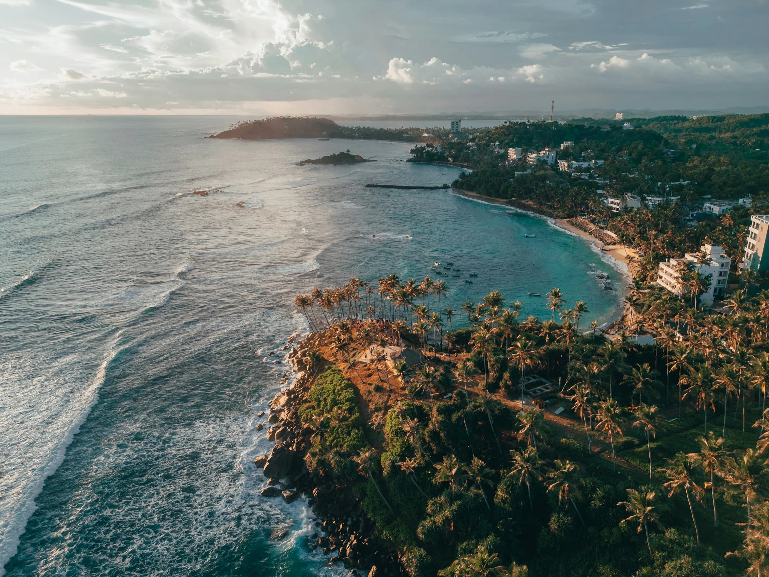 Turquoise water and palm-lined coastline at Mirissa, Sri Lanka
